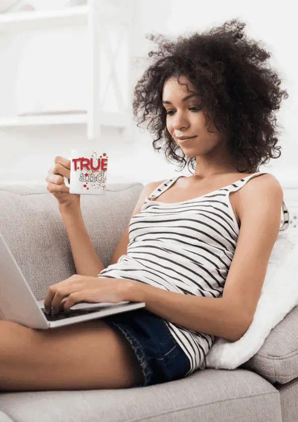 woman on couch with her new true crime merch mug