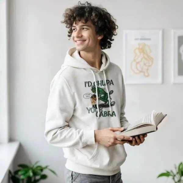 Man reading while wearing white chupacabra hoodie