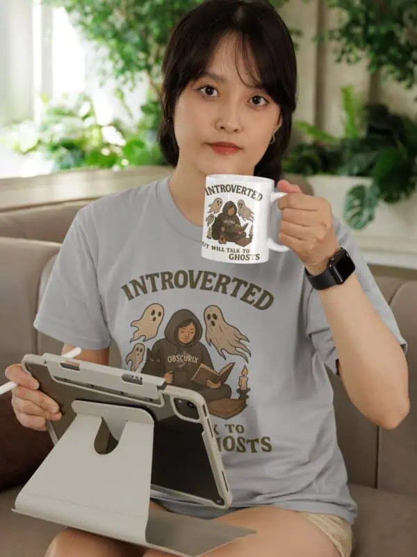 Woman drinking coffee in paranormal tee