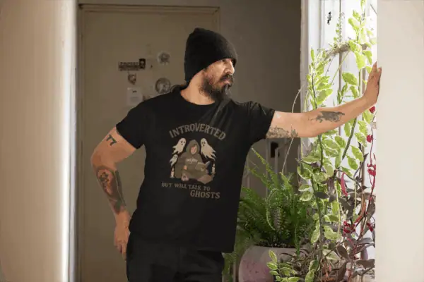 man posing in ghost hunter shirt