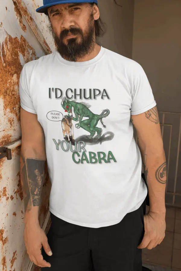 Man wearing chupacabra shirt and leaning against the wall