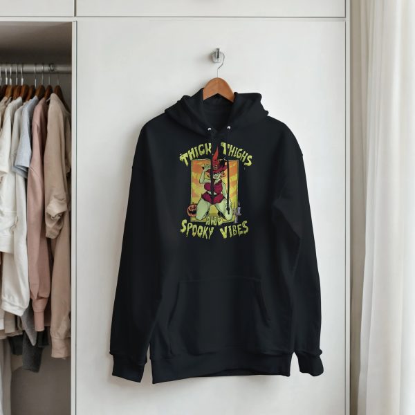 spooky season hoodie hanging in closet