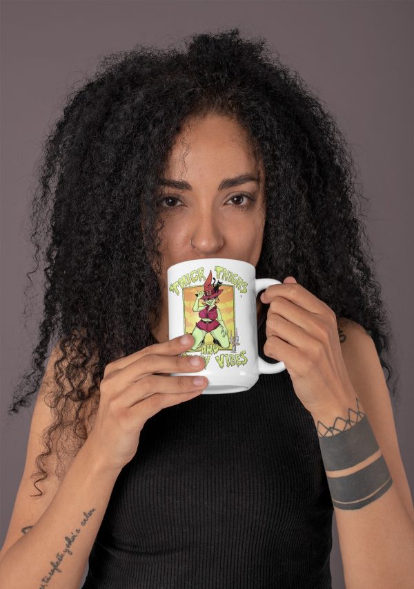 woman drinking from funny halloween coffee cup